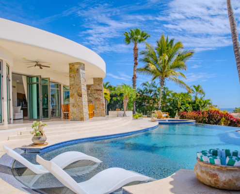 exterior of villa pool with lounge chairs