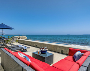 patio with lounge chairs and table overlooking the ocean patio with lounge chairs and table overlooking the ocean
